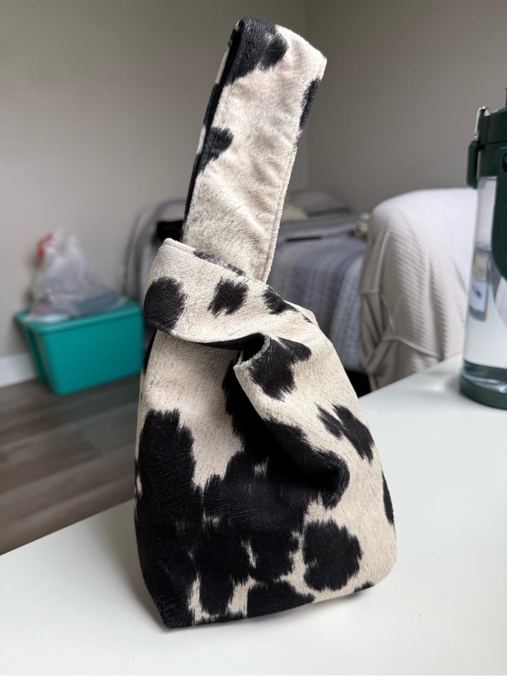 Carlton Yaito Cow-Print Knot Wristlet Clutch in Black and Cream